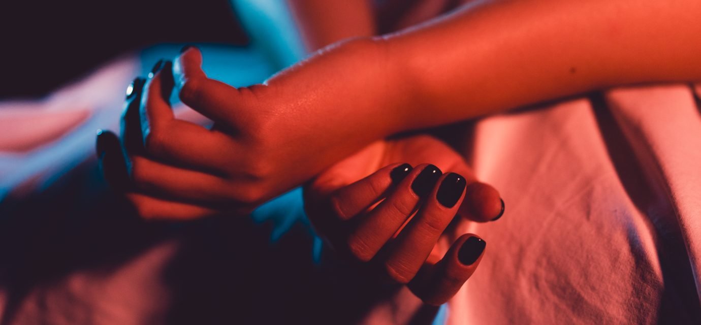 Swingers Club - Close up on female young woman's girl's beautiful hands with bla