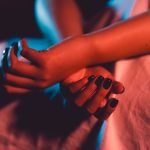 Swingers Club - Close up on female young woman's girl's beautiful hands with bla