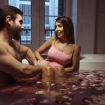 Swingers Club - happy-woman-young-man-spa-tub-with-water