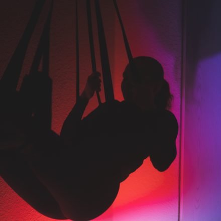 Swingers Club - low-angle-view-silhouette-woman-standing-against-orange-sky