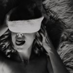 Swingers Club - portrait-young-woman-with-christmas-hat-black-white