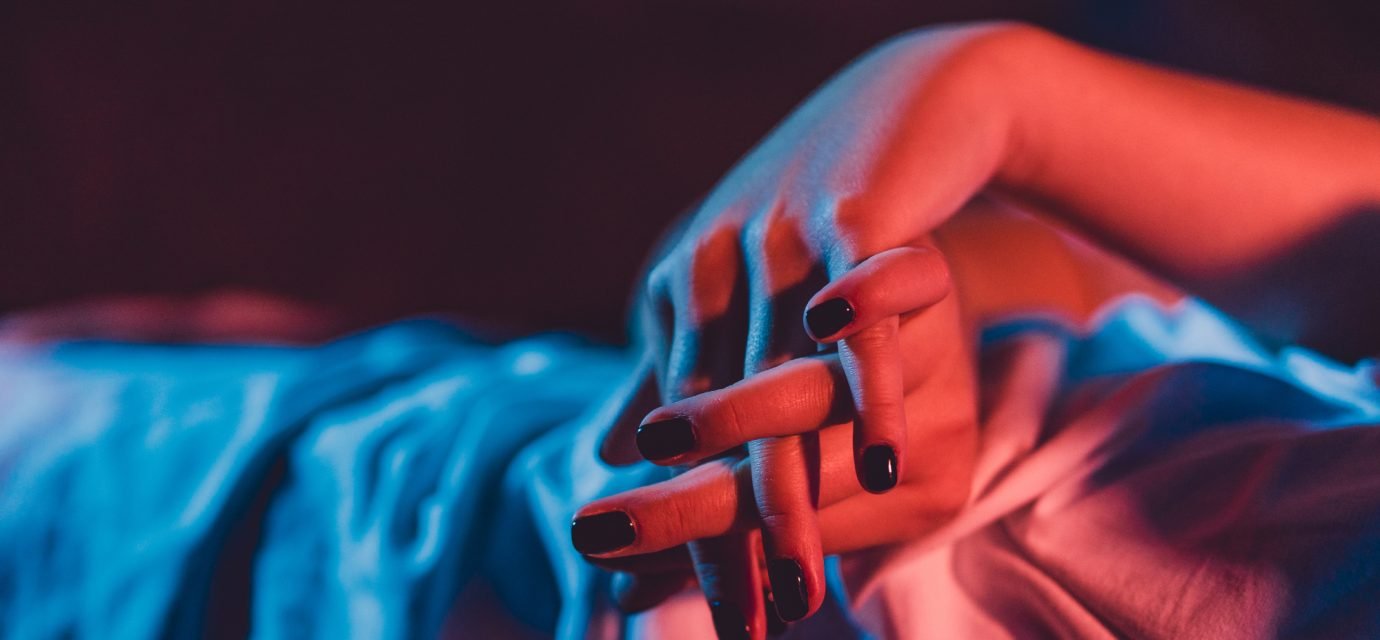 Swingers Club - Close up on female young woman's girl's beautiful hands with bla