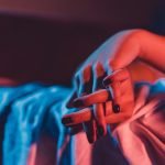 Swingers Club - Close up on female young woman's girl's beautiful hands with bla