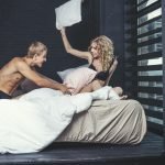 Swingers Club - Man and woman couple in their underwear in the bedroom of a beau