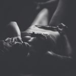 Swingers Club - seductive-woman-lying-darkroom